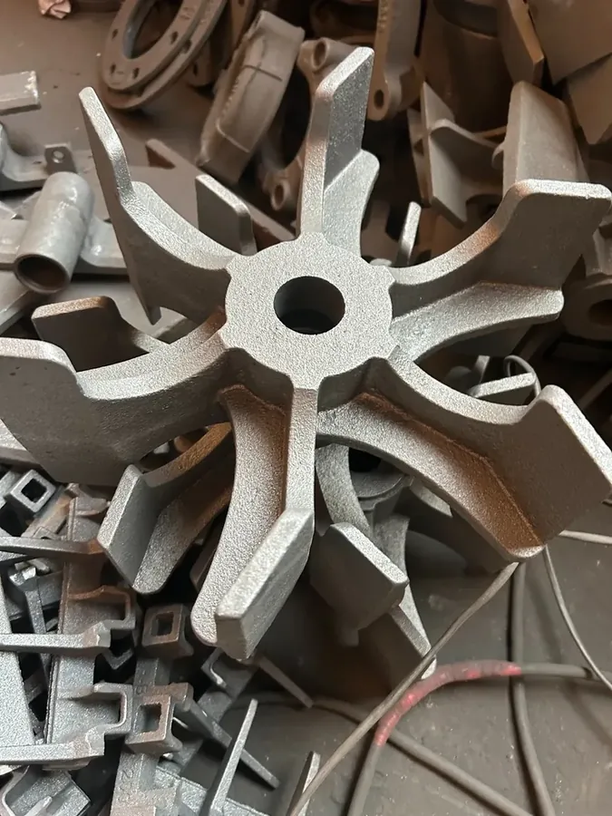 Close view of an impeller-style cast iron part
