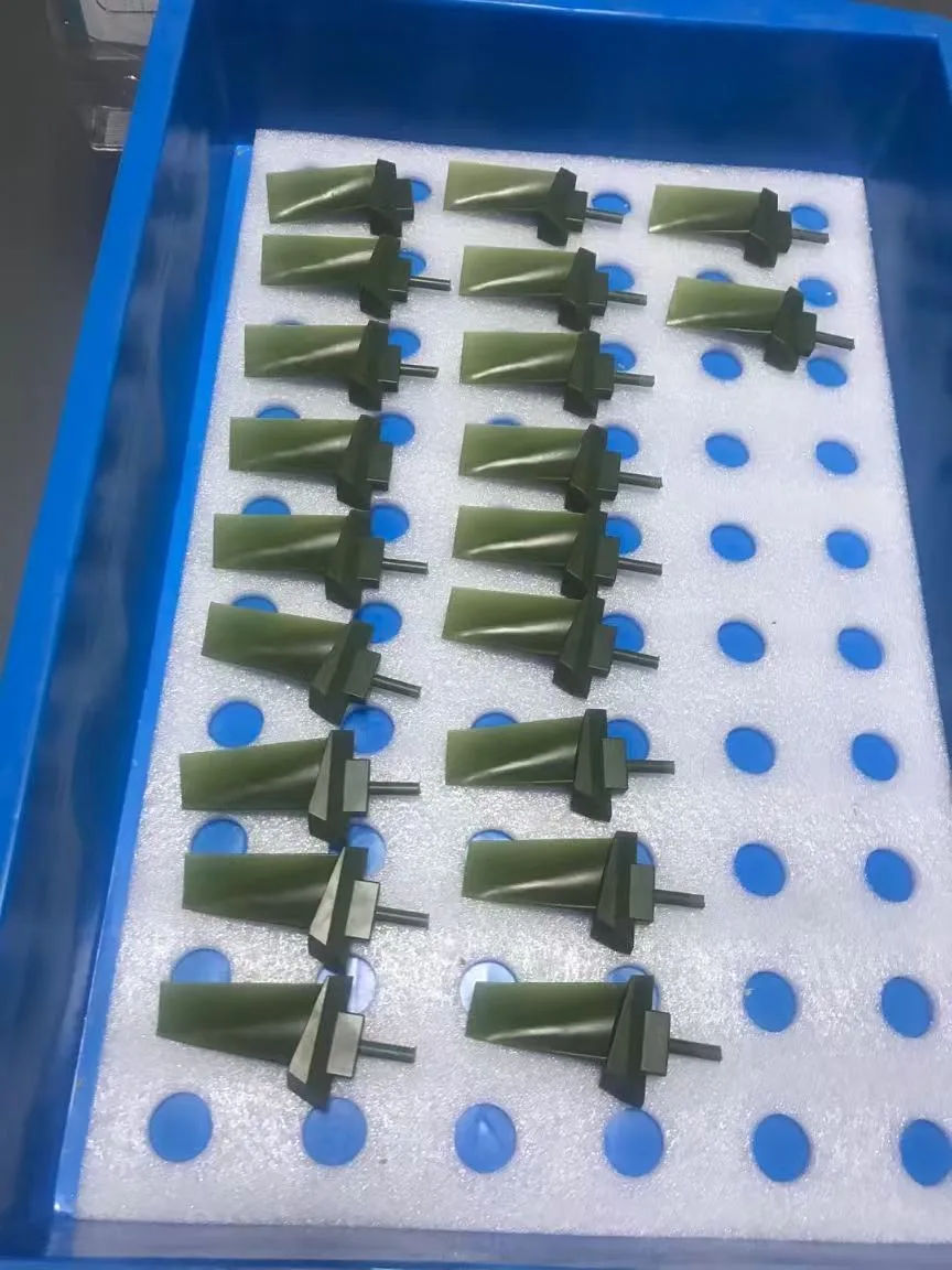 Turbocharger blade wax patterns prepared for shell building